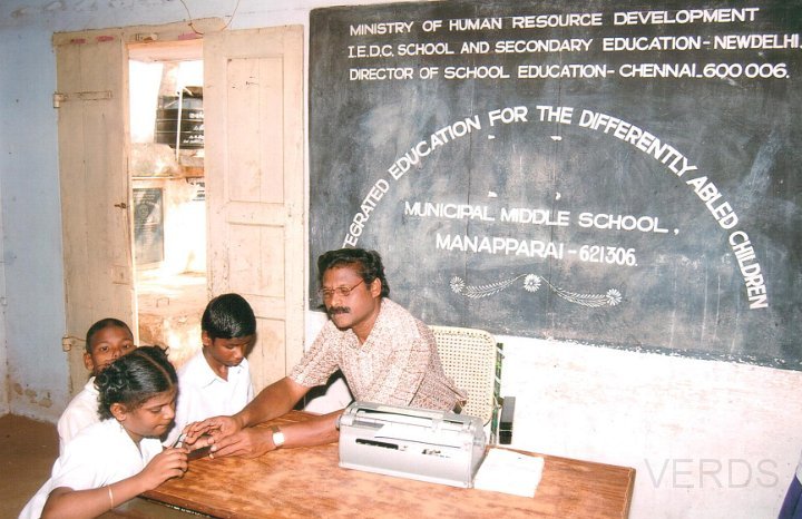 Resource teacher educating a disabled student.jpg